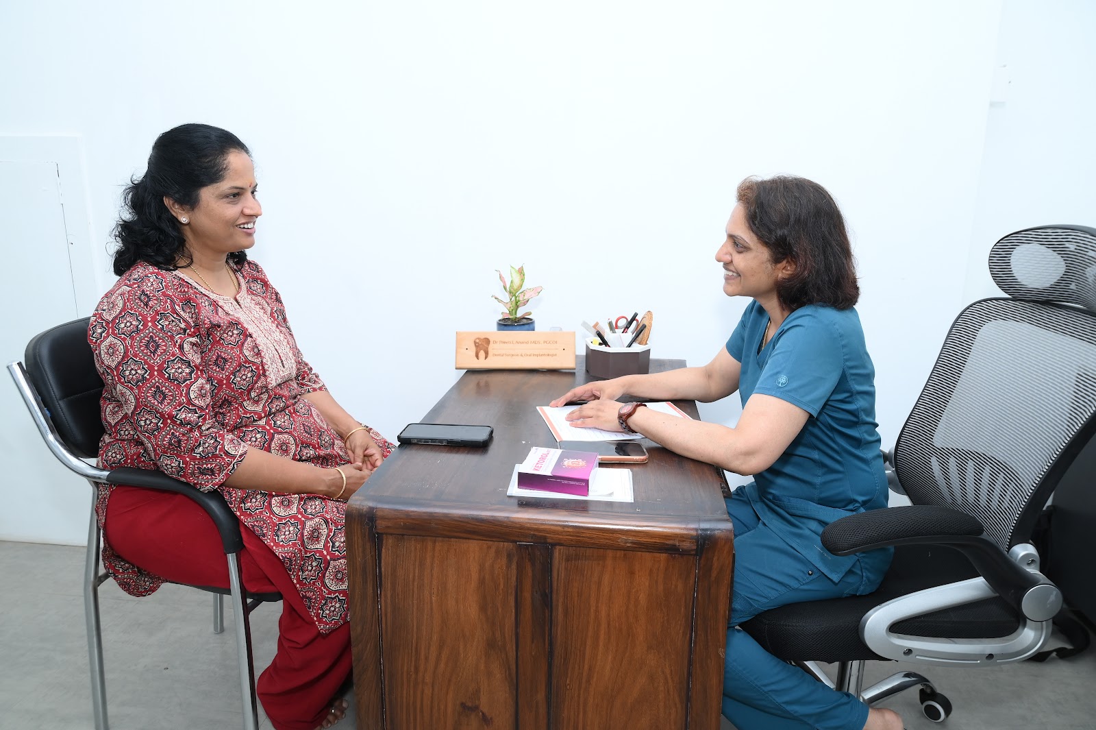 Dr. Preeti L Anand consulting with a patient