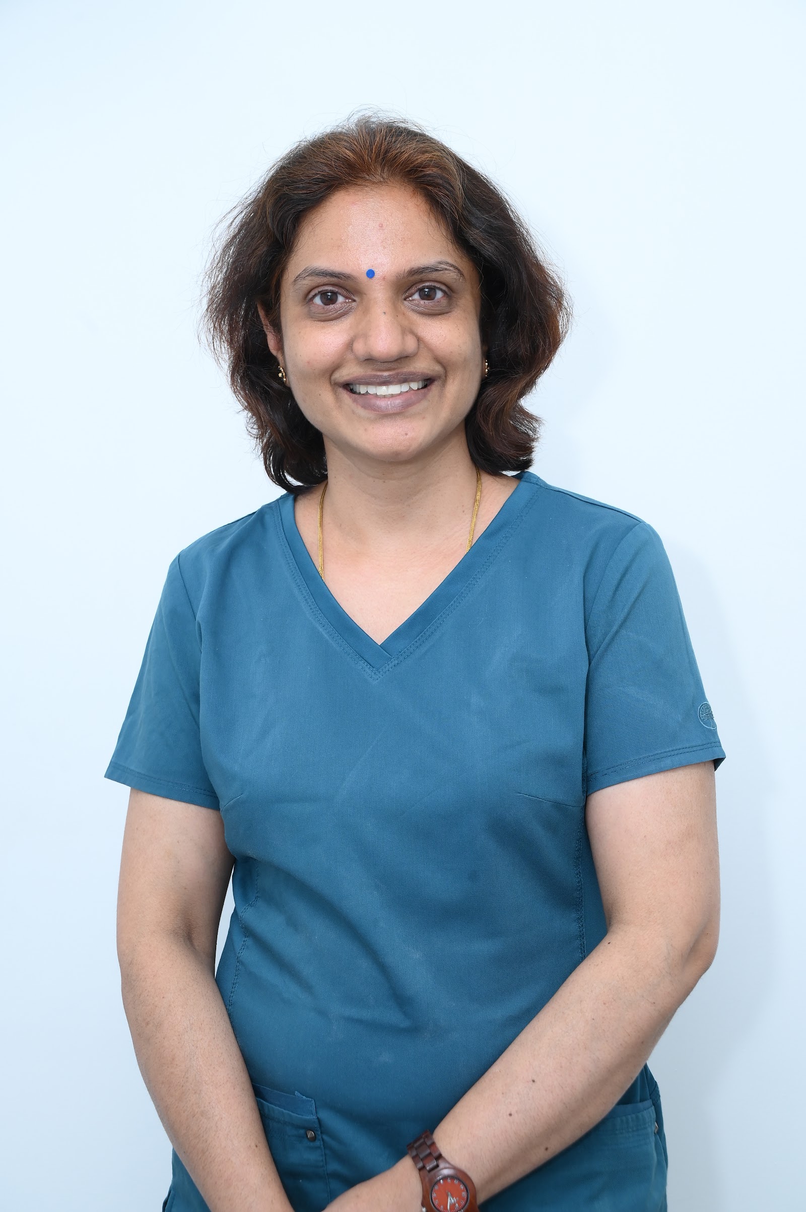 Dr. Preeti L Anand smiling — Lead Dentist at Sanjeevani Dental Besant Nagar branch